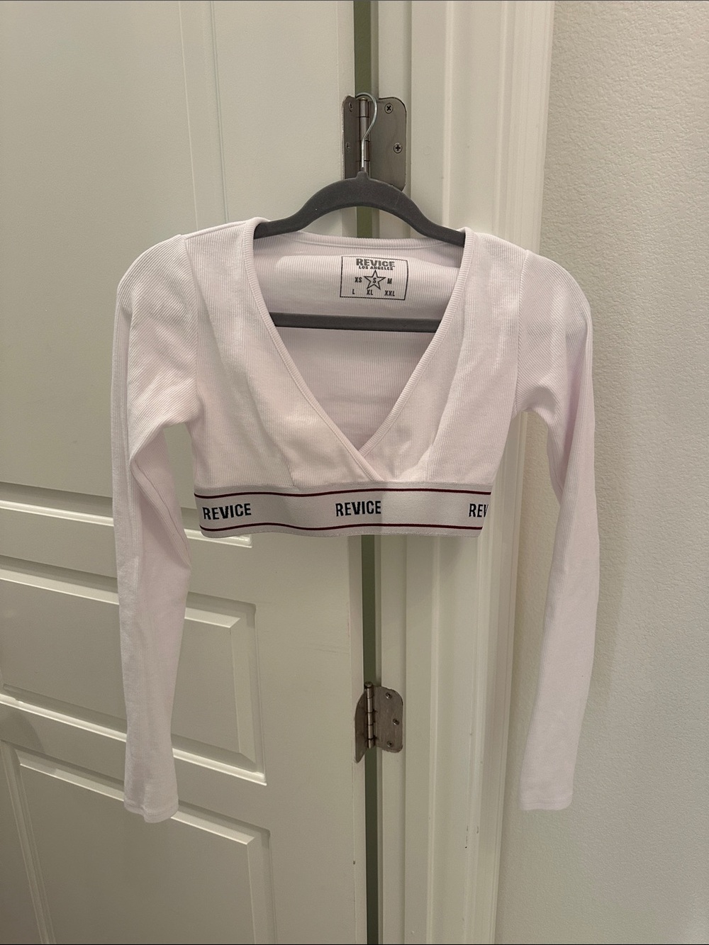REVICE White Long-Sleeve V-Neck Crop Top with Branded Band